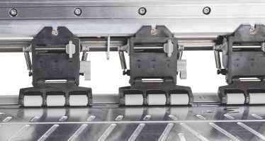 Adjustable paper feed rollers